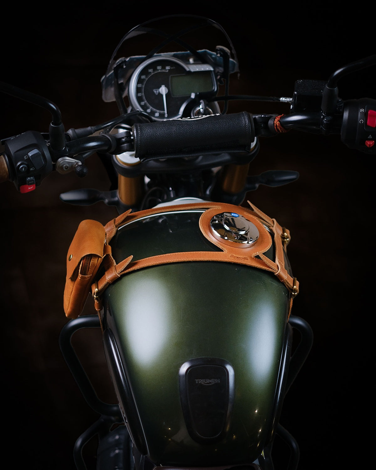 Close-up of a motorcycle's fuel tank strap