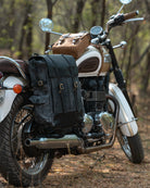 Motorcycle with saddlebags parked in a forest setting