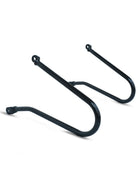 Black metal bike rack on a white background
