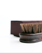 Wooden brush with bristles on a white background