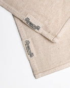 Beige fabric with 'Trip Machine' branding on a white background