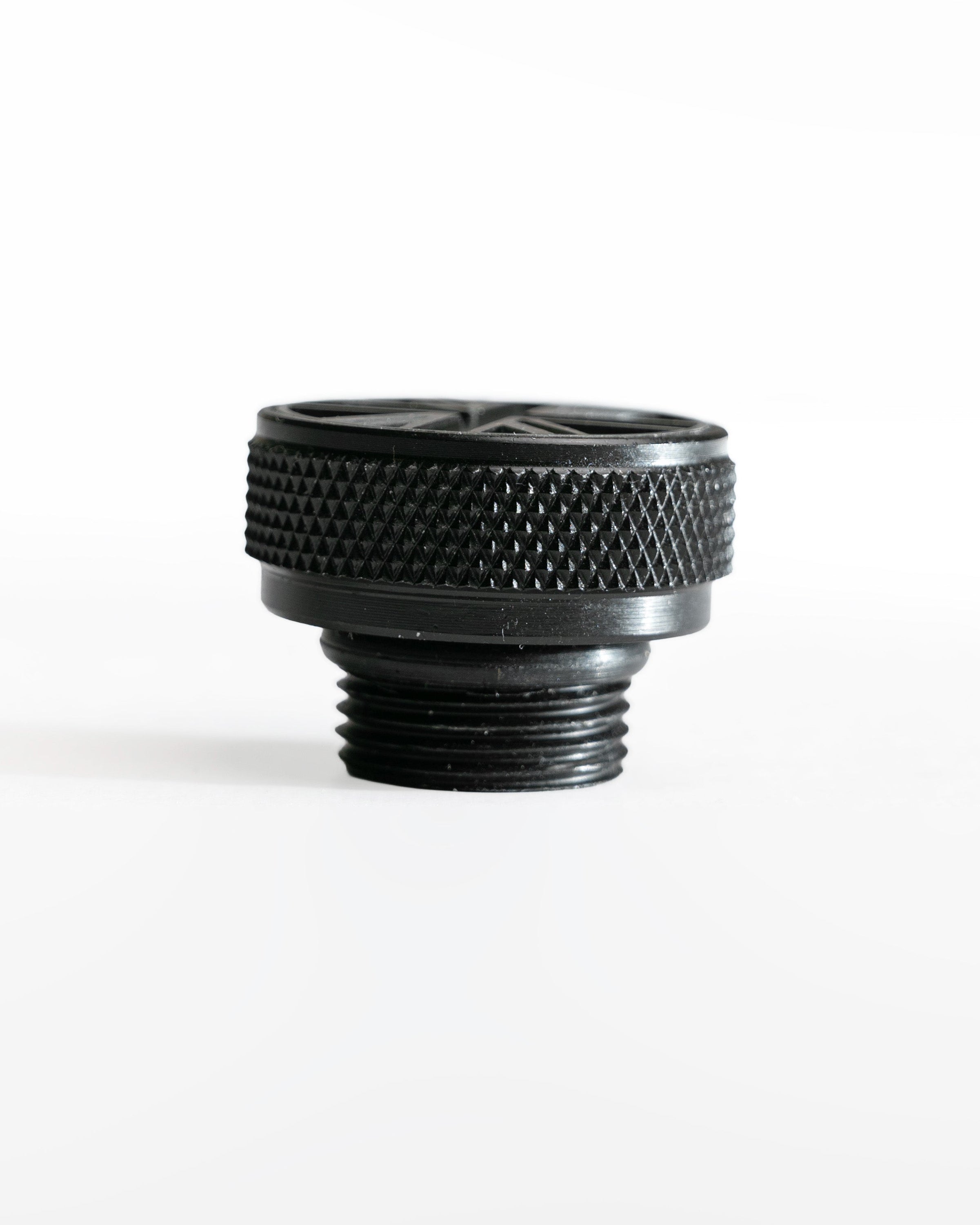 Black threaded oil filler cap on a white background
