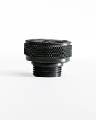 Black threaded oil filler cap on a white background