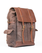 Brown leather backpack on a white background