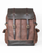 Brown leather backpack with black accents on a white background